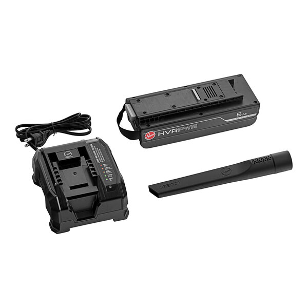 A black Hoover battery and charger with green lights.