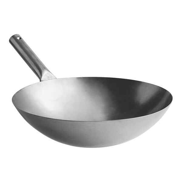 A close-up of an Emperor's Select carbon steel wok.