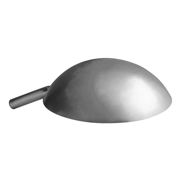 A silver carbon steel wok with a long handle.