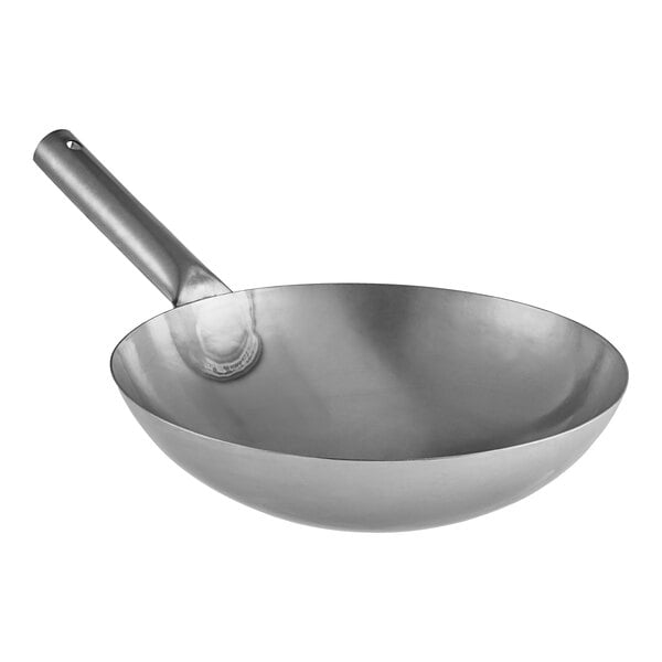 A silver Emperor's Select carbon steel wok with a handle.