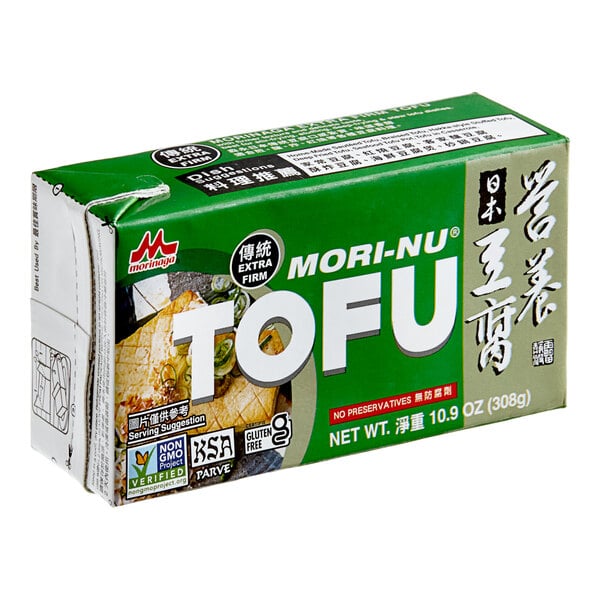 A white and green package of Mori-Nu silken extra-firm tofu.