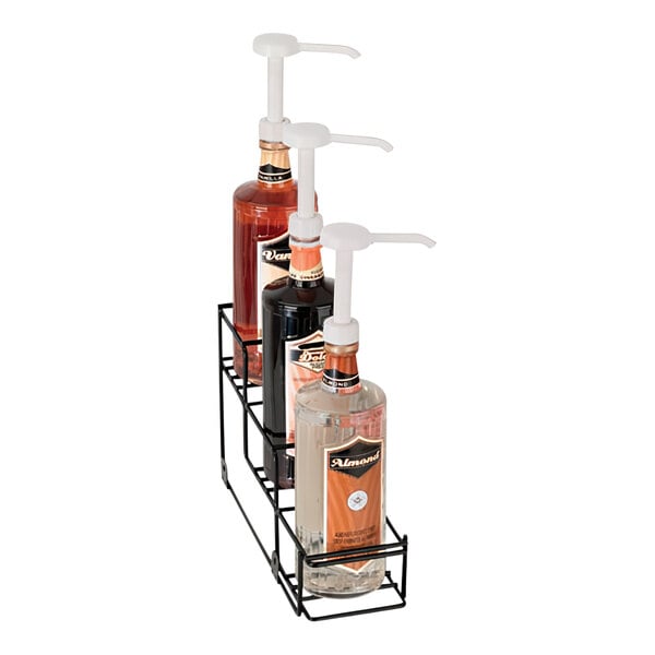 A black metal Dispense-Rite rack holding three bottles of liquid.