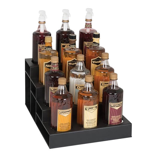 A black Dispense-Rite 4-tier stand holding bottles of liquid.