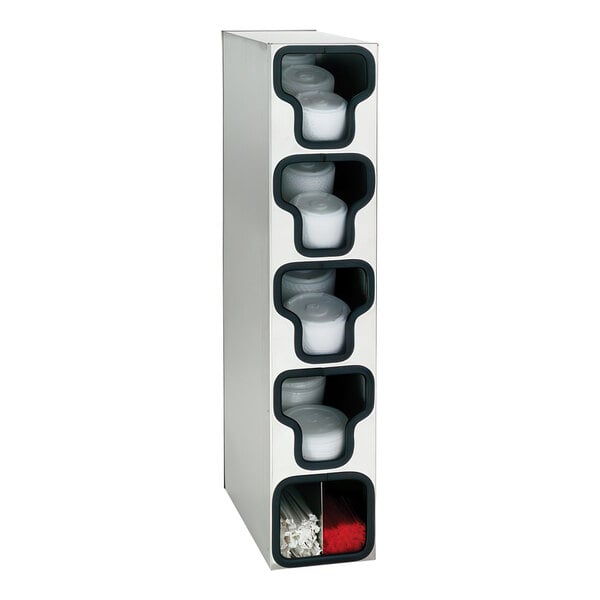 A stainless steel countertop organizer with four white containers.
