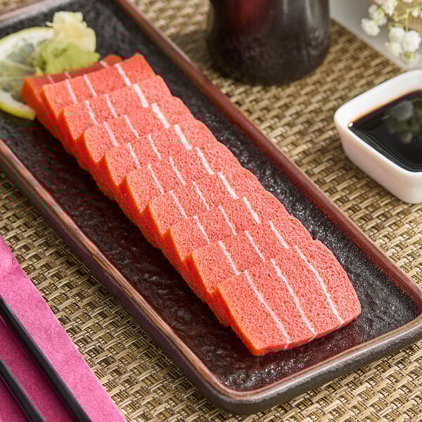 A plate with vegan tuna sashimi on it.