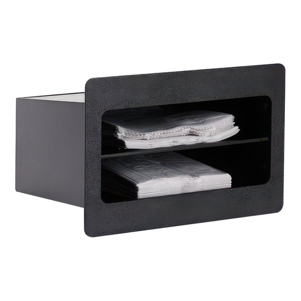 A black box with a shelf full of papers.