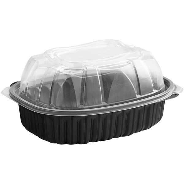 A black D&W Fine Pack plastic chicken roaster take-out container with a clear lid.