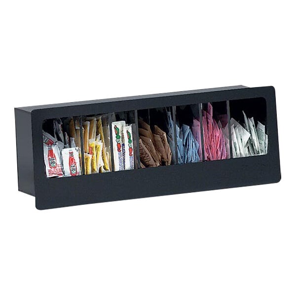 A black built-in Dispense-Rite condiment organizer with different types of packets inside.