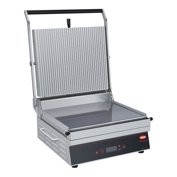A Hatco Single Panini Grill on a counter with a lid on top.