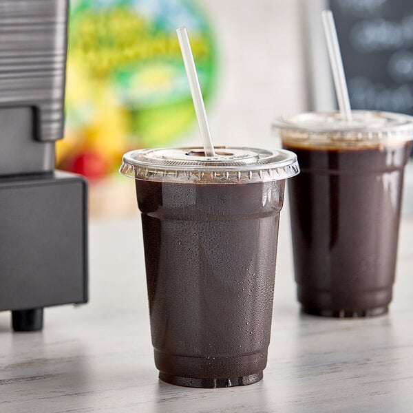 A plastic cup with Fresh Blends Earl E. Burt's cold brew coffee in it on a counter.