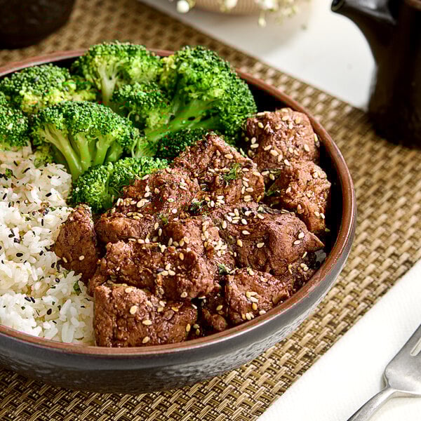 A bowl of rice and broccoli with Franklin Farms Seasoned Cubed Seitan.
