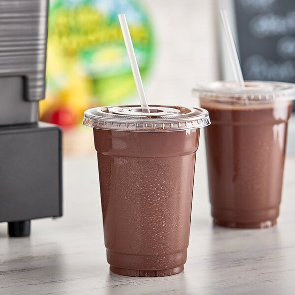 Two cups of Fresh Blends Chocolate Beverage on a counter with straws.