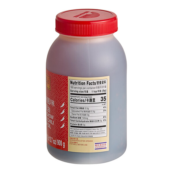 A plastic jar of Lee Kum Kee Chiu Chow Chili Oil with a red lid.