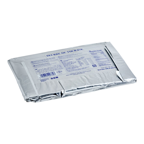 A rectangular sheet of Isigny Sainte-Mere frozen unsalted lamination butter wrapped in silver foil packaging.