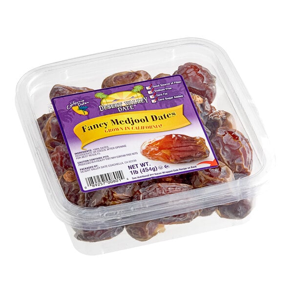 A plastic container of Whole Dried Fancy California Medjool Dates.