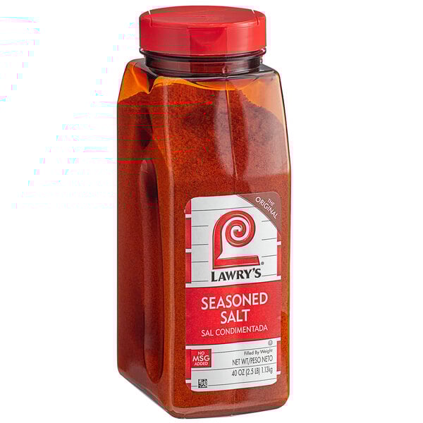A plastic jar of Lawry's Seasoned Salt with red powder inside.