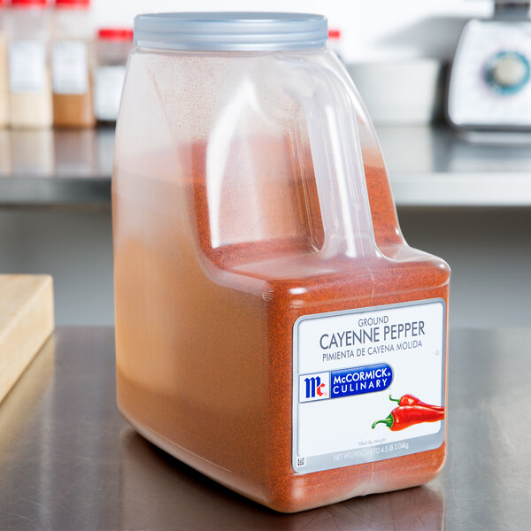 A case of McCormick Culinary Ground Cayenne Pepper on a counter.