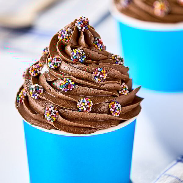 A cup of chocolate ice cream with Mini Rainbow Chocolate Nonpareils on top.