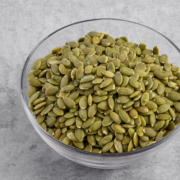 A bowl of Hometown Provisions raw pumpkin seeds.