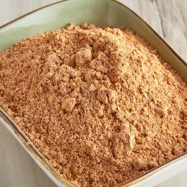 A bowl of McCormick Culinary taco seasoning.
