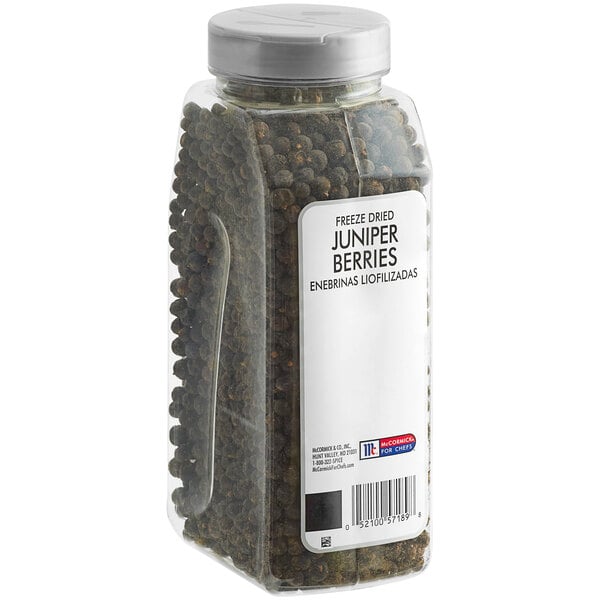 A plastic container of McCormick Culinary Freeze-Dried Juniper Berries with a label on it.