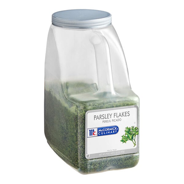 A plastic container of McCormick Culinary Parsley Flakes.