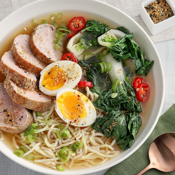 A bowl of ramen with McCormick Culinary Asian Spiced Sea Salt on top.