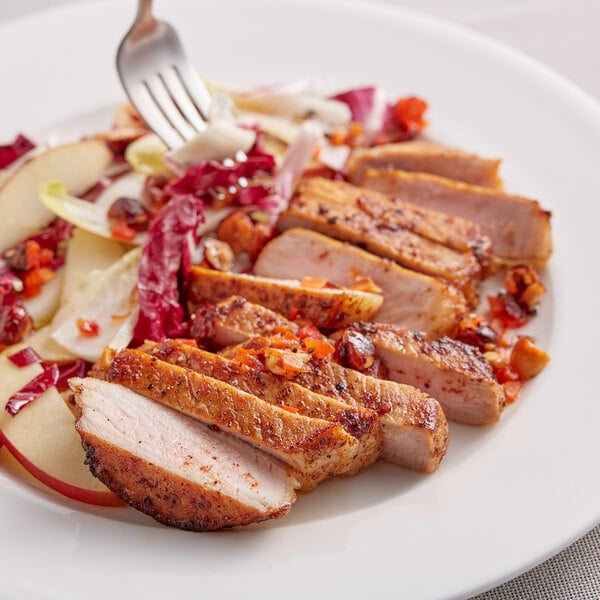 A plate of food with Lawry's Smoky Chile and Cumin Rub on meat slices and vegetables.