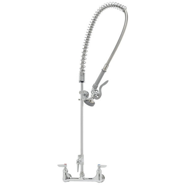 A silver T&S pre-rinse faucet with a hose attached.