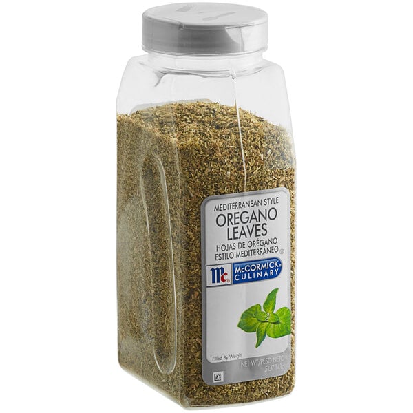 A white container of McCormick Culinary Mediterranean Oregano leaves.