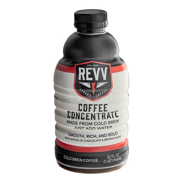A black plastic bottle of REVV Coffee Cold Brew Concentrate with a white label on a counter.