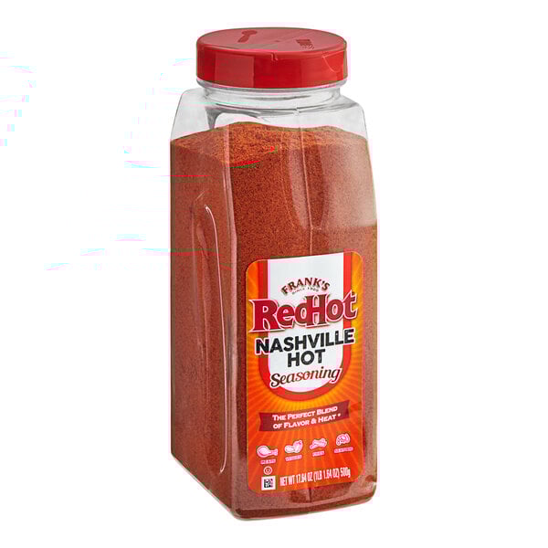 A container of Frank's RedHot Nashville Hot seasoning with red powder inside.