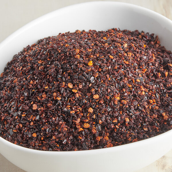 A bowl of McCormick Culinary Crushed Chipotle Pepper.