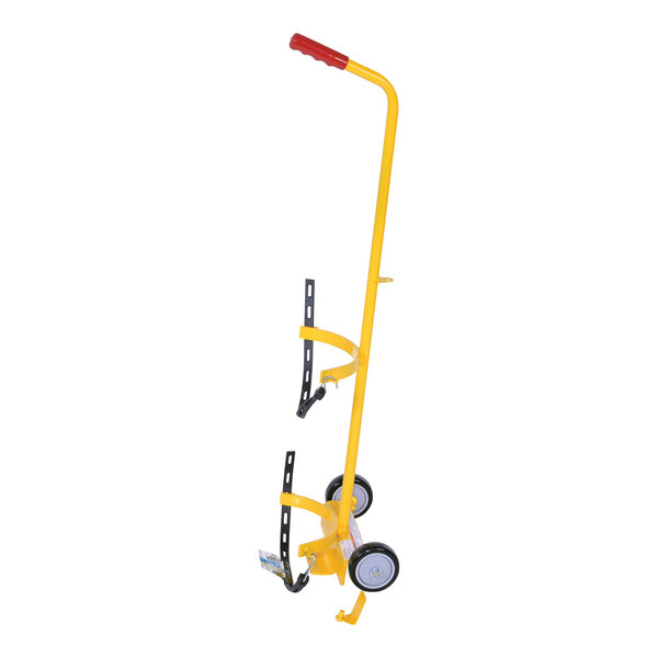 A yellow Vestil hand truck with black wheels and a red handle used to carry a fire extinguisher.