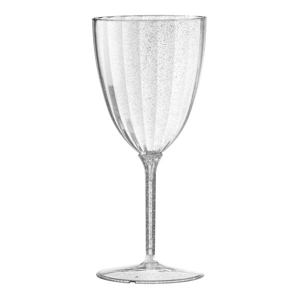A close-up of a Posh Setting plastic wine goblet with clear liquid and small specks on it.