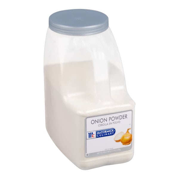 A large plastic container with a gray lid, filled with a white powder and labeled as onion powder.