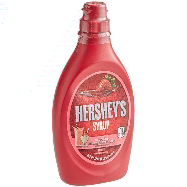 A close up of a bottle of HERSHEY'S Strawberry Syrup.
