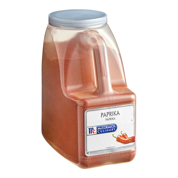 A white plastic container of McCormick Culinary Paprika with a red lid and label.