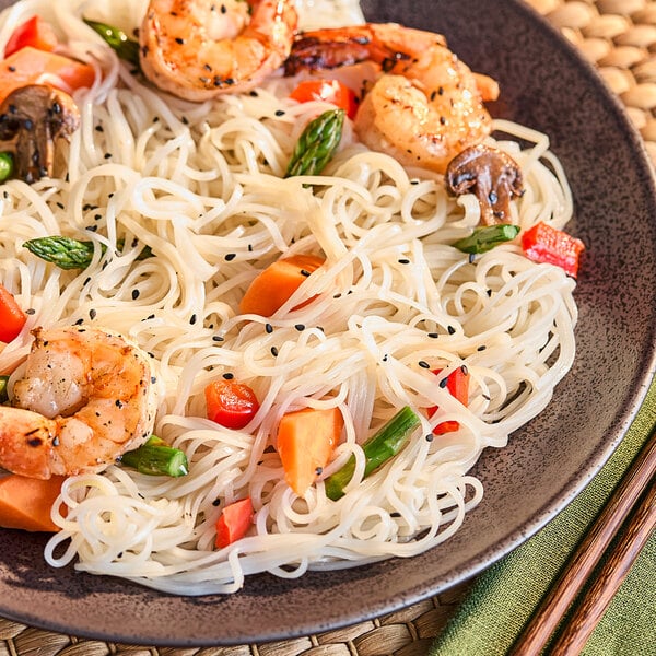 A plate of Erawan Thai rice stick noodles with shrimp and vegetables.