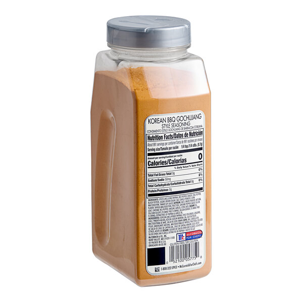 A plastic container of brown McCormick Culinary Korean BBQ Gochujang Style Seasoning.