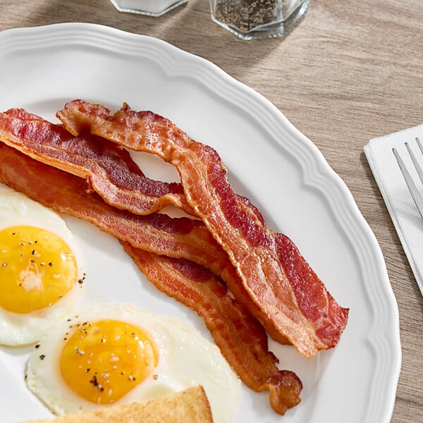 A plate of bacon and eggs with Daily's XX Thick Bacon on it.