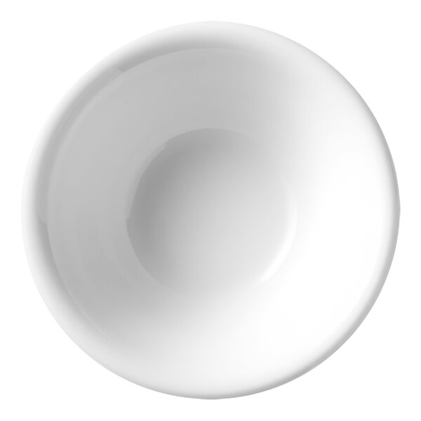 A close up of a Libbey Porcelana bright white porcelain fruit bowl.
