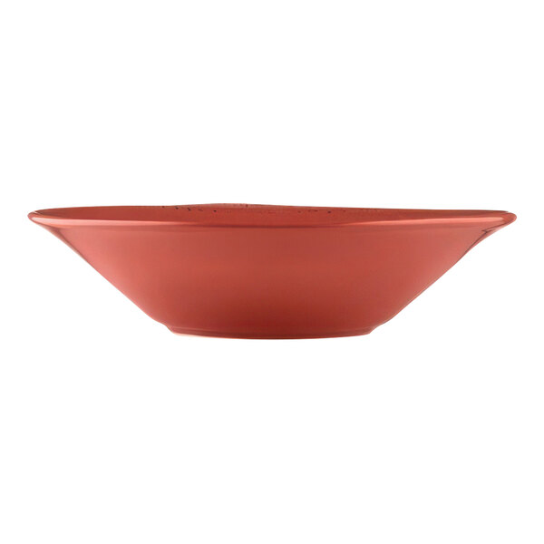 A red Libbey porcelain grapefruit bowl with a white surface.