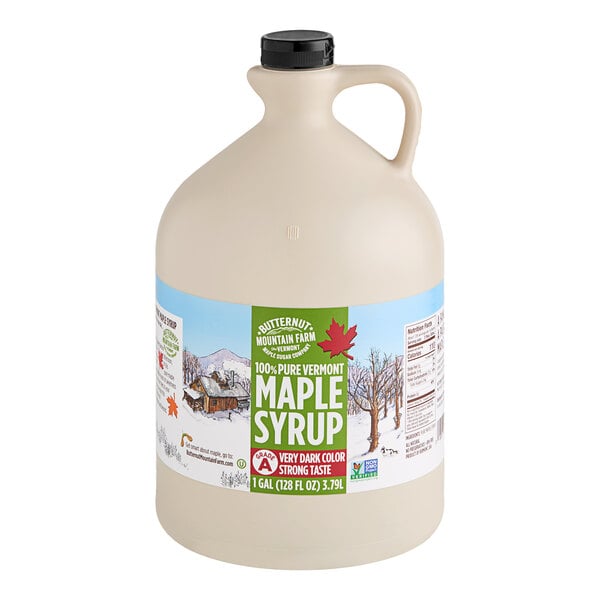 A large jug of Butternut Mountain Farm Grade A Very Dark Pure Vermont Maple Syrup with a handle.