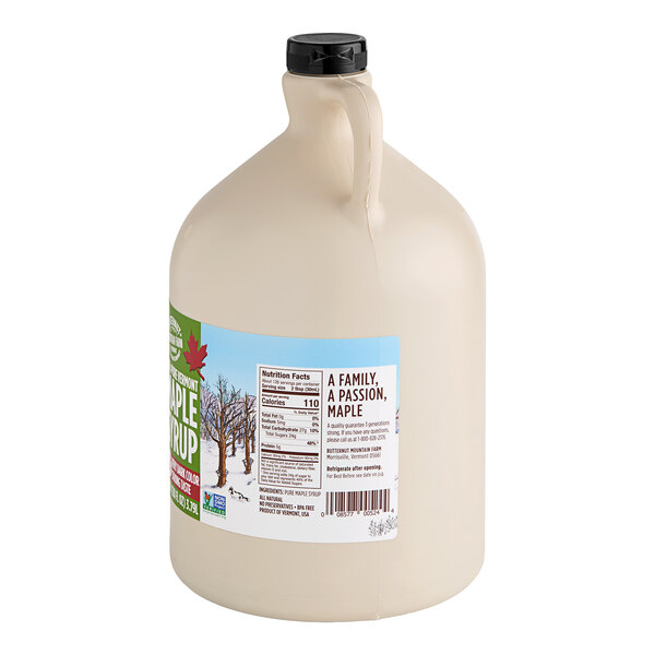 A white jug of Butternut Mountain Farm Grade A Very Dark Pure Vermont Maple Syrup with a label.