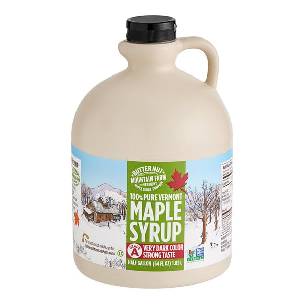 A Butternut Mountain Farm jug of maple syrup with a handle.