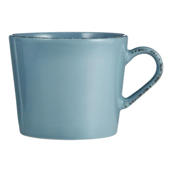 A close-up of a Libbey blue porcelain cup with a handle.