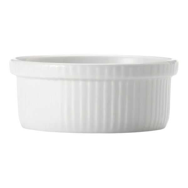 A white porcelain souffle dish with a ribbed edge.