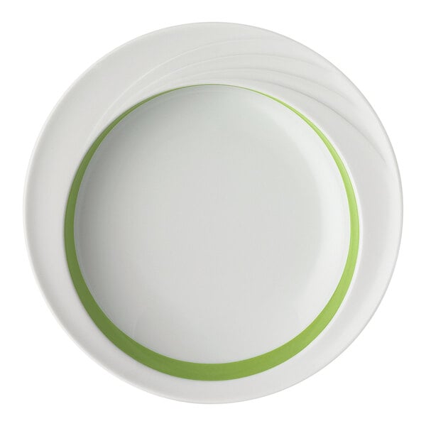 A white porcelain comfort bowl with a light green band around the inner rim.