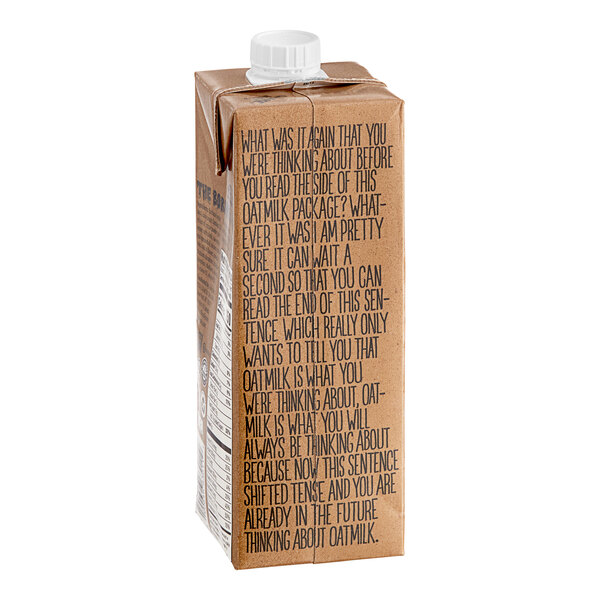 A carton of Oatly Chocolate Oat Milk with a white cap.